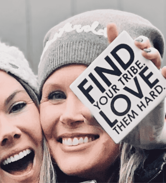 Two women sharing a moment with a message-led ceramic coaster — connection gift by Let’s Be Frank