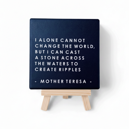 Let's Be Frank Australia square ceramic coaster featuring a Mother Teresa quote on a dark blue background on a stand.